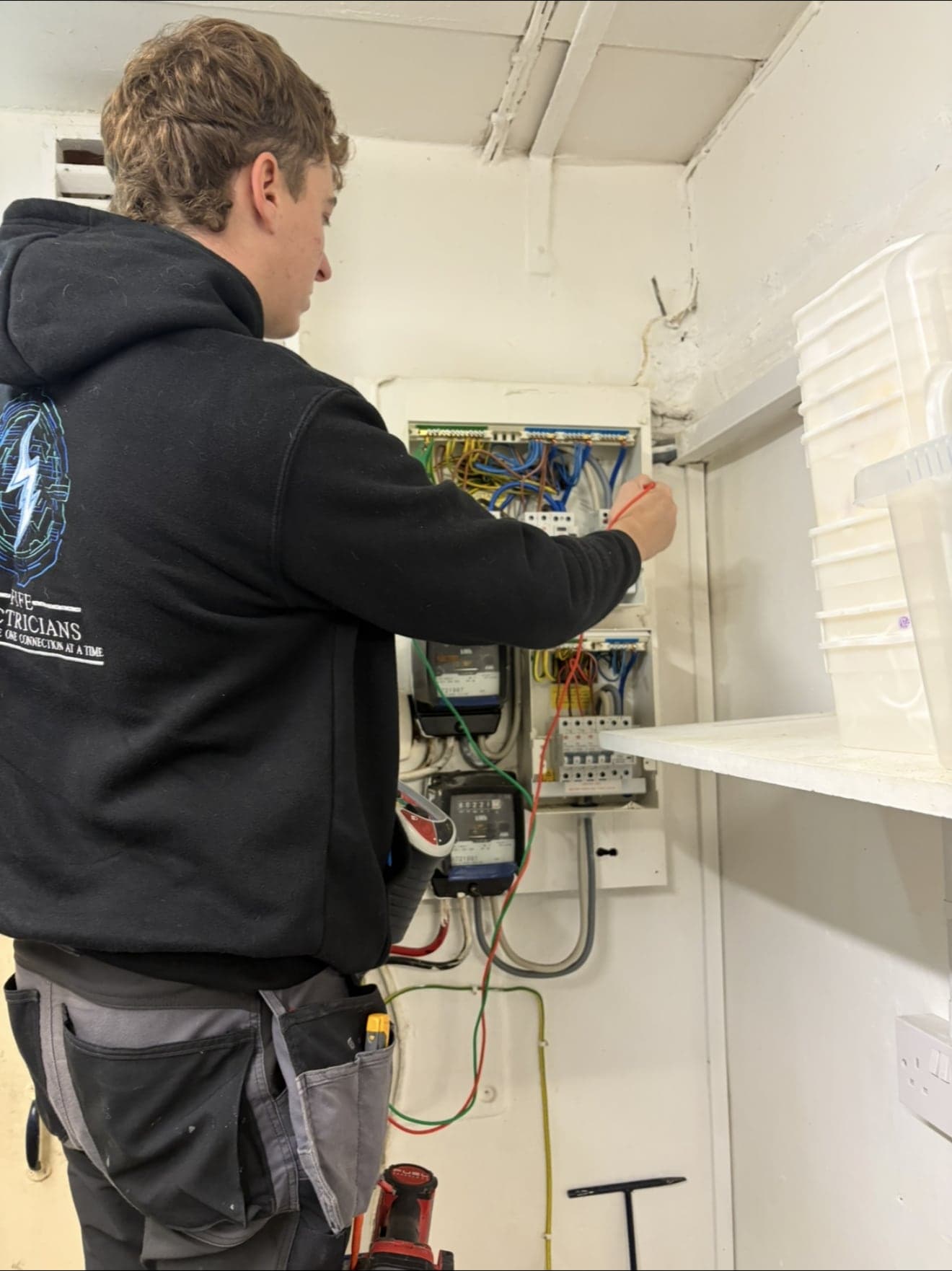 Fife Electricians carrying out electrical testing at a consumer unit